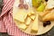 Cheeseboard with pears and wine on a table