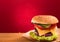 Cheeseburger closeup on red background