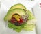 Cheeseburger With Lettuce, Onions, Ketchup, Mustard and Avocado