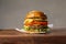 Cheeseburger on a wood plate on gray background