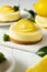 Cheesecake lemon tart cake or pie, with fresh lemon and mint. White background, lifestyle healthy desert