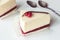 Cheesecake with red currant and chocolate strip, serving slices