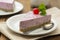 Cheesecake slice with berries and coffee cup, pink cheesecake on wooden background, dessert or breakfast. Sweet food