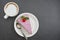 Cheesecake slice with berries, pink cheesecake isolated with coffee cup, flat lay with copy space