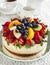 Cheesecake topped with berries and fruits