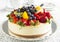 Cheesecake topped with berries and fruits