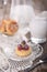 Cheesecakes or cottage cheese pancakes, decorated with berries and mint, lie in a plate on a beautifully decorated table on a