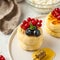 Cheesecakes decorated with fresh berries and honey on a plate. Food photos for dessert and Breakfast menus.