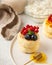 Cheesecakes decorated with fresh berries and honey on a plate. Food photos for dessert and Breakfast menus.