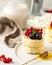 Cheesecakes decorated with fresh berries and honey on a plate. Food photos for dessert and Breakfast menus.