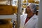 Cheesemaker checking ready product in a storage room