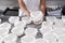 Cheesemaker turns the shapes of fresh cheese