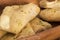 Cheesy garlic bread in a wooden dish