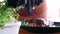 Chef adding a microgreens on roasted duck at restaurant