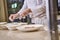 Chef adding spices to dishes in many bowls