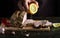 The chef adds fresh lemon juice to the baked meat. Work environment on the kitchen table of the restaurant. Close-up of cook hand