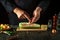 The chef adds minced meat to the zucchini on the kitchen table. The concept of delicious national stuffed squash for diner