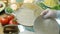 The chef arranges some tortillas on the cooking table