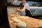 Chef or baker weighing dough on scale at bakery