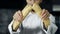 Chef breaking french bread in slow motion. Closeup baker hands breaking bread.