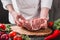 Chef Butcher cutting pork meat on kitchen, cooking food.