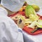 Chef carves patterns on cabbage and other vegetables and fruits for a beautiful table decoration