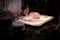 Chef  Carving Slice of Italian baked ham on board, Chef hand cutting roasted ham Catering service employee cutting ham for people