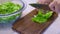 Chef chopping lettuce rapidly at home kitchen