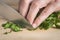 Chef chopping parsley leaves