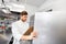 Chef with clipboard doing inventory at kitchen