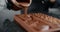 Chef confectioner makes chocolate bar - he pours hot melted chocolate to the silicone form, art of handmade chocolate