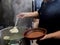 Chef coocking georgian khinkali or japanese wonton.