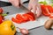 Chef cook cutting a pepper