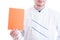 Chef or cook holding orange cardboard with copy space