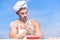 Chef cook preparing dough for baking with flour. Baker concept. Man on busy face wears cooking hat and apron, sky on