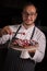 Chef cook preparing tart in his kitchen. Delicious raspberry  tart tartlet with whipped cream.