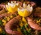 Chef cooking a paella with prawns, lemon and assorted seafood. Tasty dish Spain