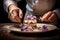A chef creating a visually stunning dessert plate with edible flowers background