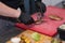 Chef cuts freshly cooked flavorful chicken for guests in a pub.