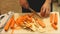 Chef cutting carrots in restaurant