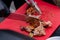 Chef cutting chicken meat on table at street food festival - close up view