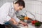 Chef Cutting Meat On Chopping Board