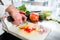 Chef cutting onions and vegetable to prepare for cooking