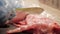 Chef cutting raw rabbit meat