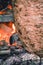 Chef cutting traditional Turkish food Shawarma meat Doner Kebab in the outdoor restaurant