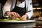 chef elegantly plating a rye bread sandwich