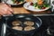 Chef Frying Dough in Pan