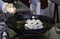 Chef frying mushrooms