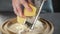 Chef grates cheese for making pie, grated cheese, dishes from cheese