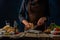 The chef grates Parmesan cheese to prepare the classic Caesar salad. Many ingredients for the salad are on the table. Rough wooden